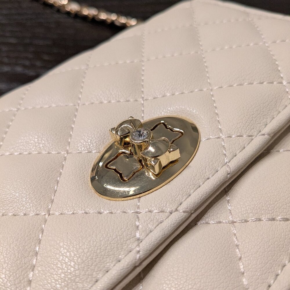Cream Quilted Crossbody Purse with Gold Chain & Floral Clasp
